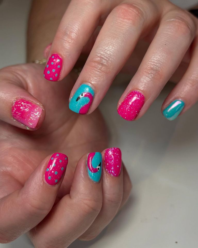 Pink and blue nails with flamingo designs
