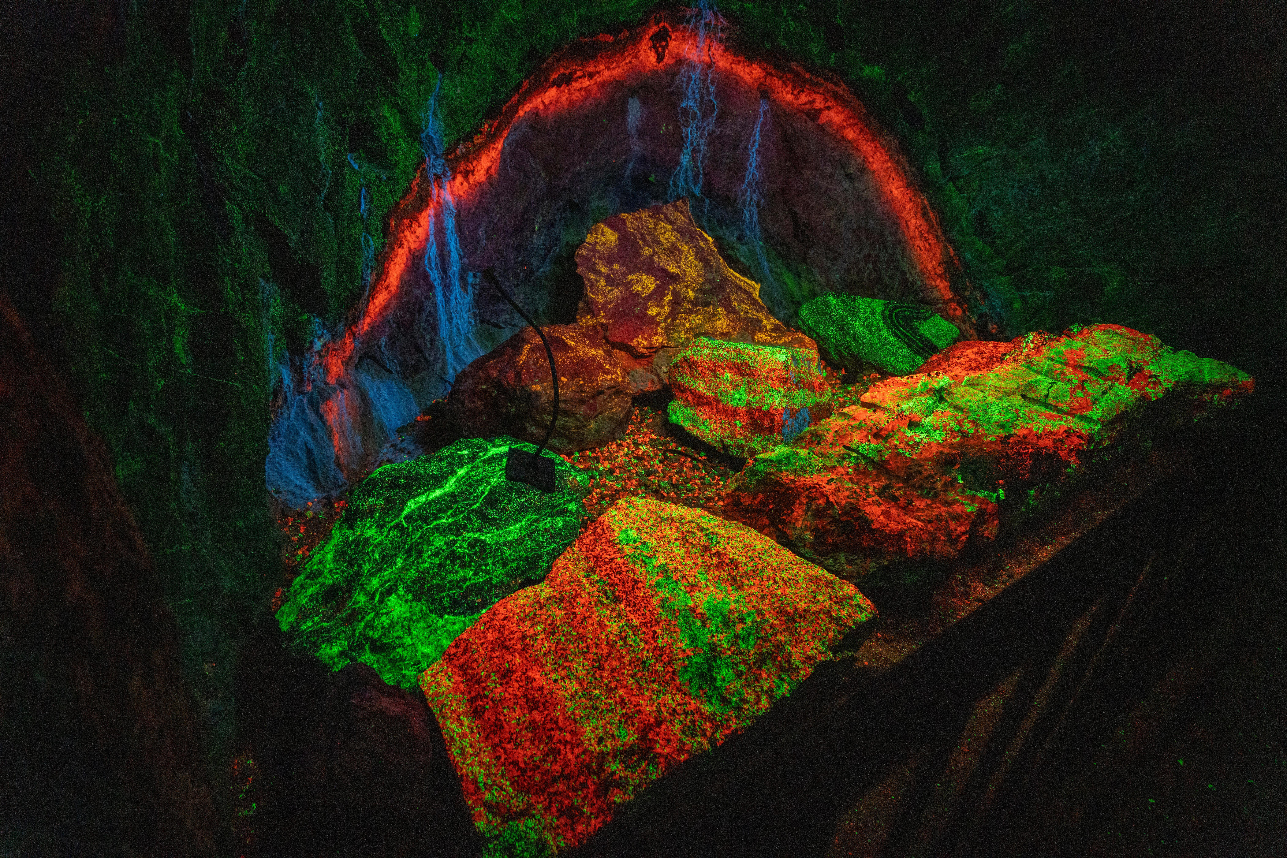 Fluorescent rocks glow inside Sterling Hill Mine Museum on Tuesday, May 26, 2026, in Ogdensburg.