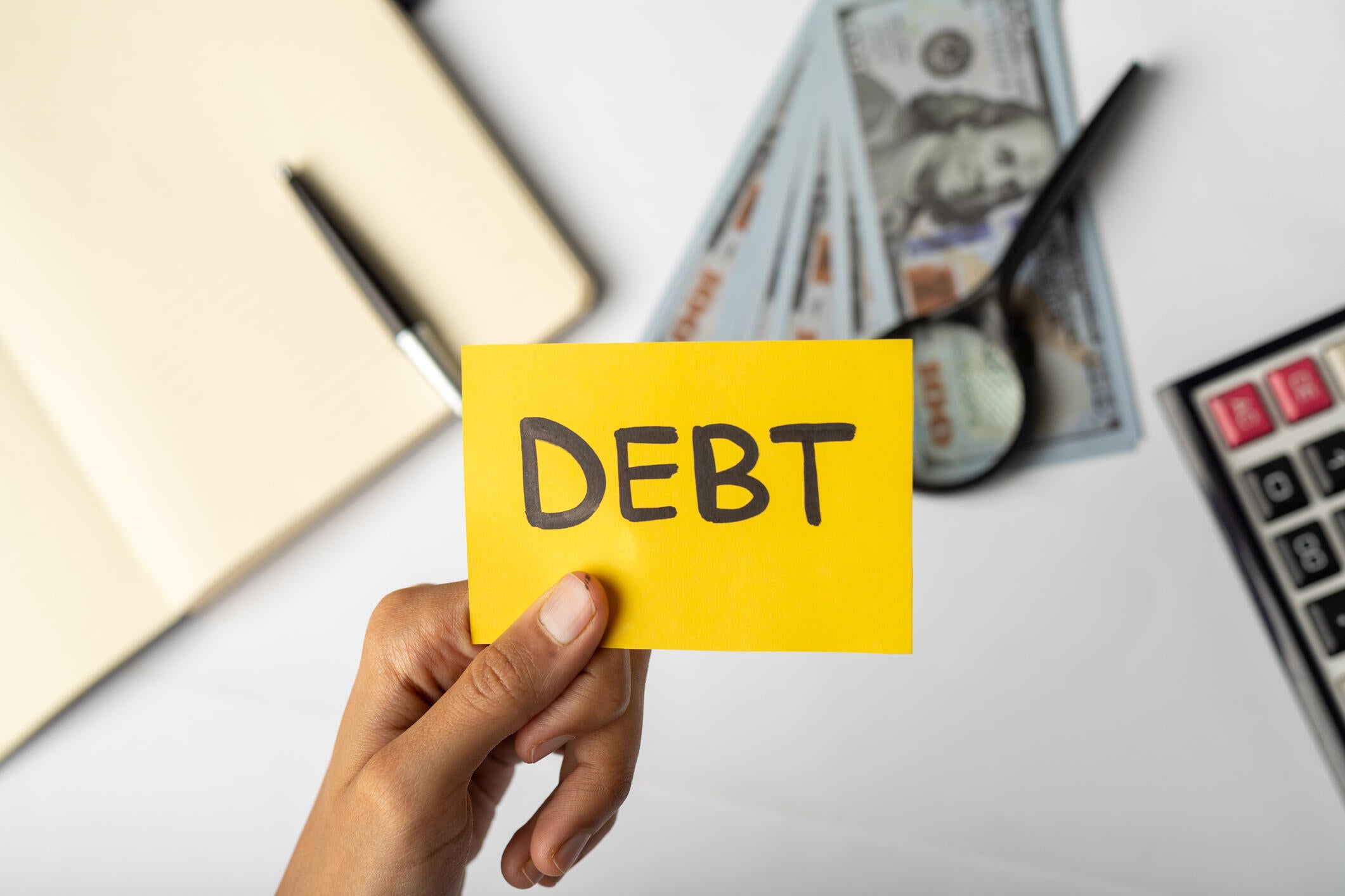 Some debts are discharged after you die, while others may need to be paid by the estate or others. / Credit: Muhammad Aqib/Getty Images