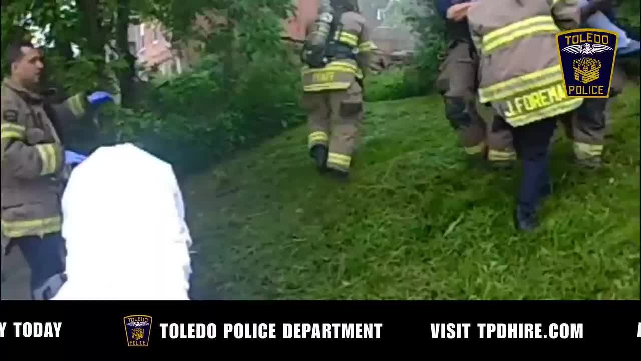 Bodycam: Toledo officer rescues woman needing walker from burning home