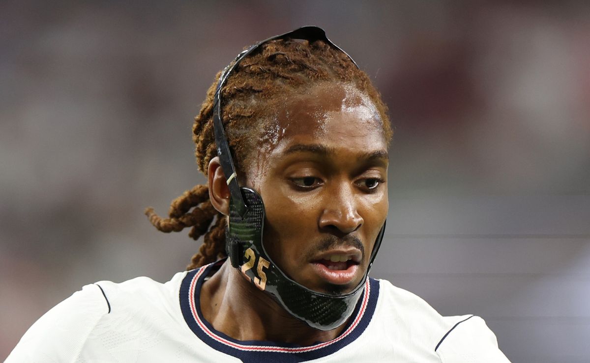 Djed Spence playing with protective jaw guard due to injury