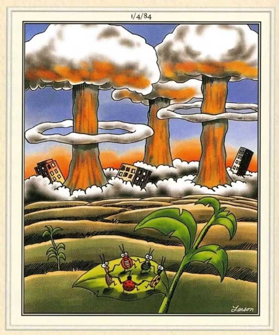 A bunch of bugs holding hands and standing in a circle as nuclear explosions go off in the background