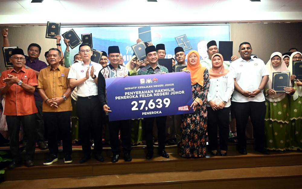 Johor Felda settlers’ long wait for land title ends