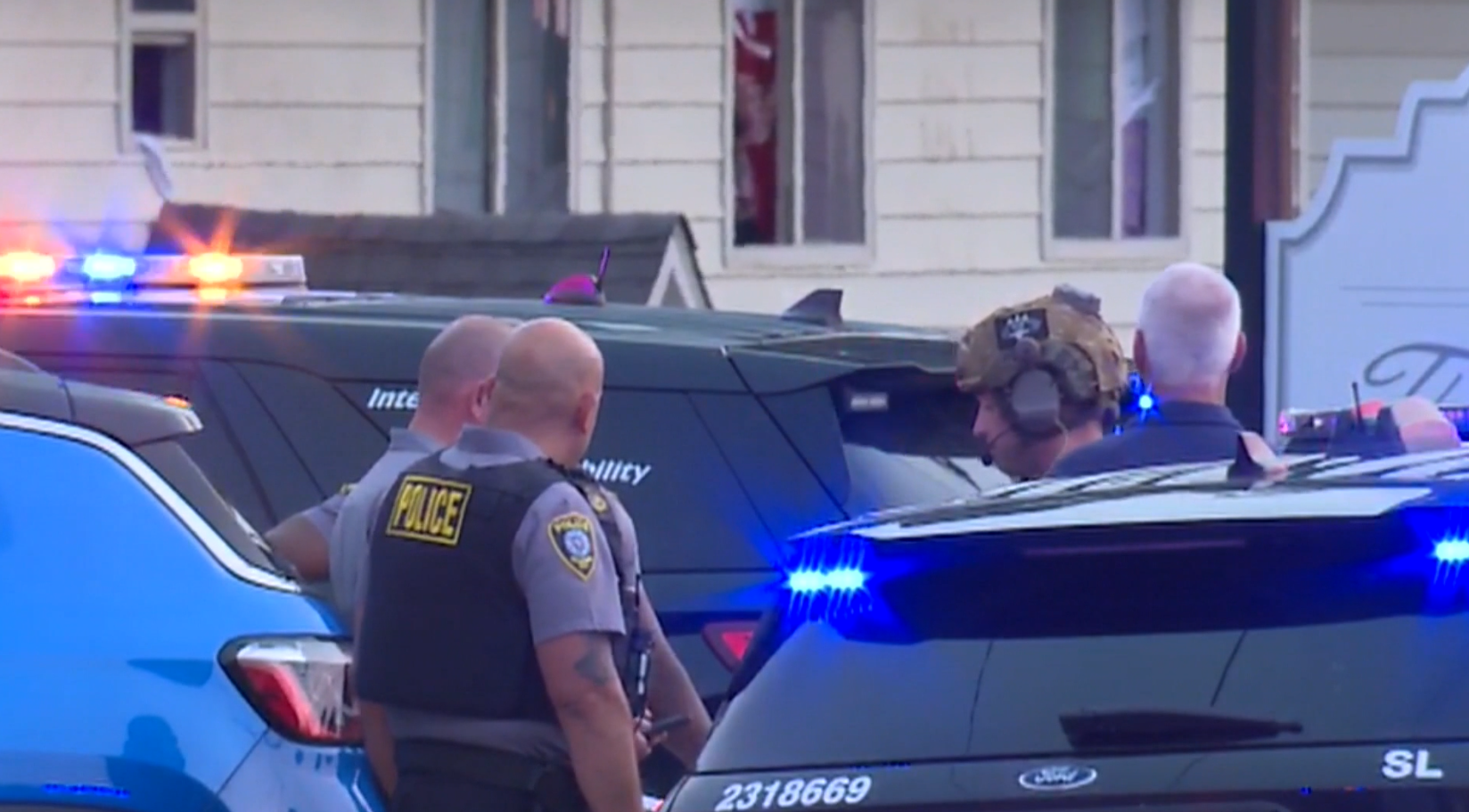Police release new details after officer fired at armed suspect ...