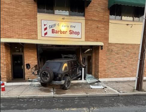 Police investigating after Hartford woman drives through barbershop