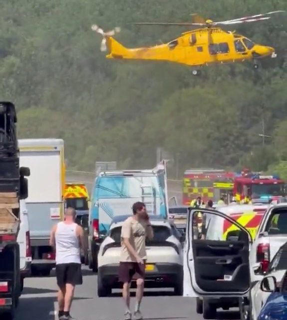 Drivers get out of baking cars after M25 crash during red alert heatwave