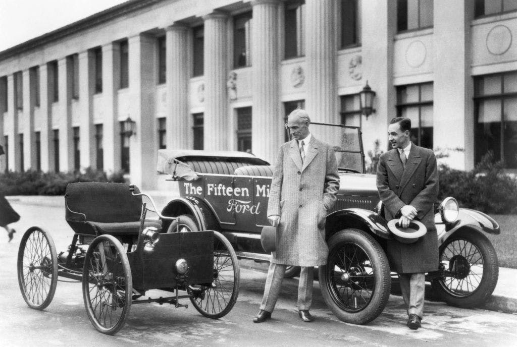 Henry and Edsel Ford with 1896 quadricycle and 15 millionth model T