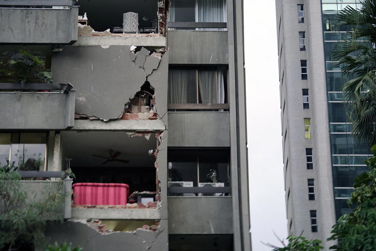 A damaged apartment building is seen following an earthquake in Caracas Credit: Manaure Quintero / AFP via Getty Images