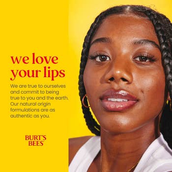 Close-up of a person showcasing glossy lip products with text about Burt's Bees' commitment to authenticity and natural formulations