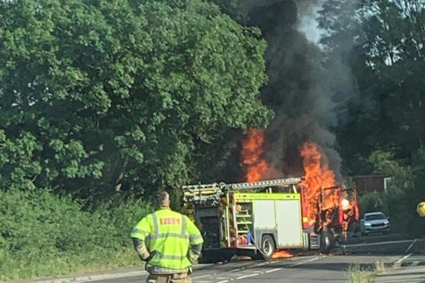 Explosions heard as fire engine bursts into flames on route to crash