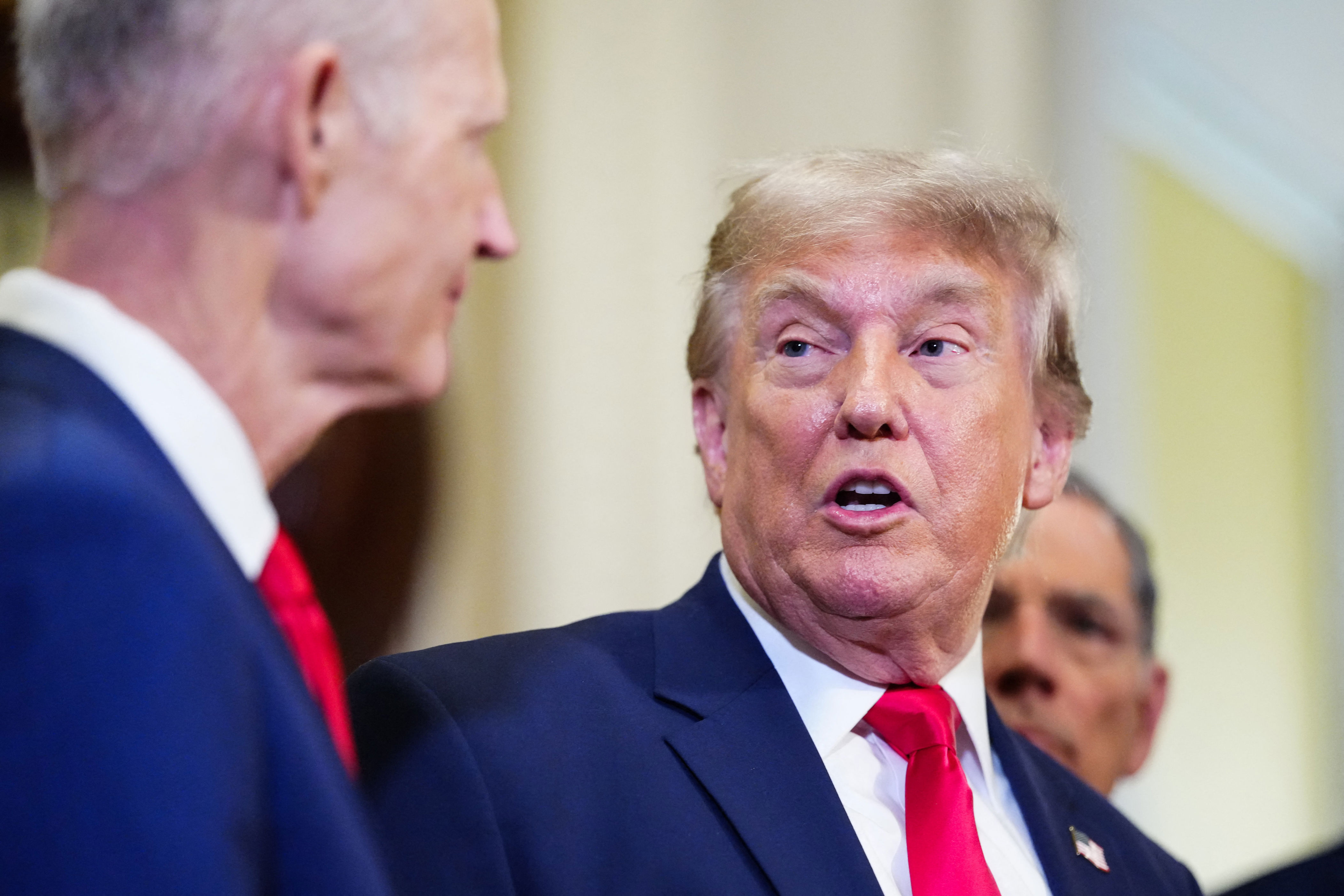 Senator Rick Scott, Republican from Florida, looks on as President Donald Trump speaks to the press after a lunch meeting with Senate Republicans (AFP/Getty)