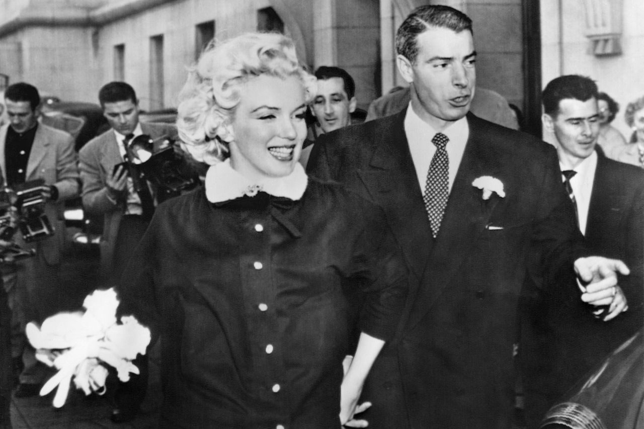 Joe Di Maggio and Marilyn Monroe after their wedding.