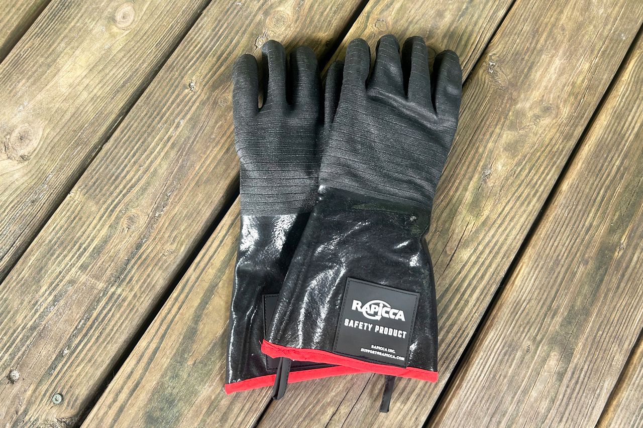 The top of a pair of RAPICCA BBQ Gloves on a deck