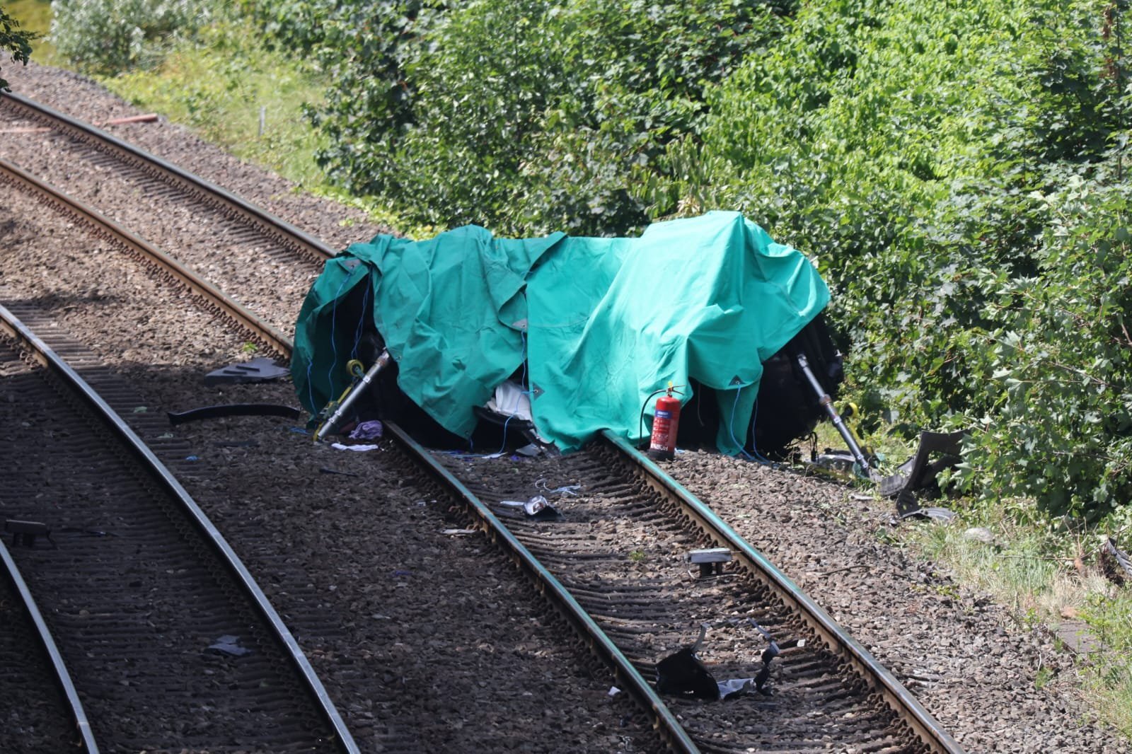 One dead and child fighting for life after train crashes into car