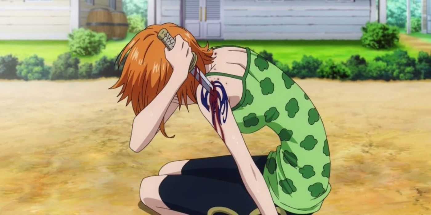 Nami cuts through her Arlong Pirates tattoo during the Arlong Parc Arc in One Piece.