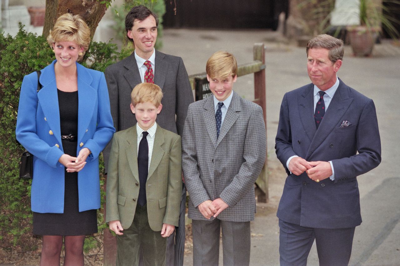 British Royal Diana, Princess of Wales (1961-1997), wearing a blue jacket over a black dress, with Eton housemaster Dr Andrew Gailey, Prince Harry, Prince William, and Prince Charles outside Manor House on Prince William's first day at Eton College in Eton, Berkshire, England