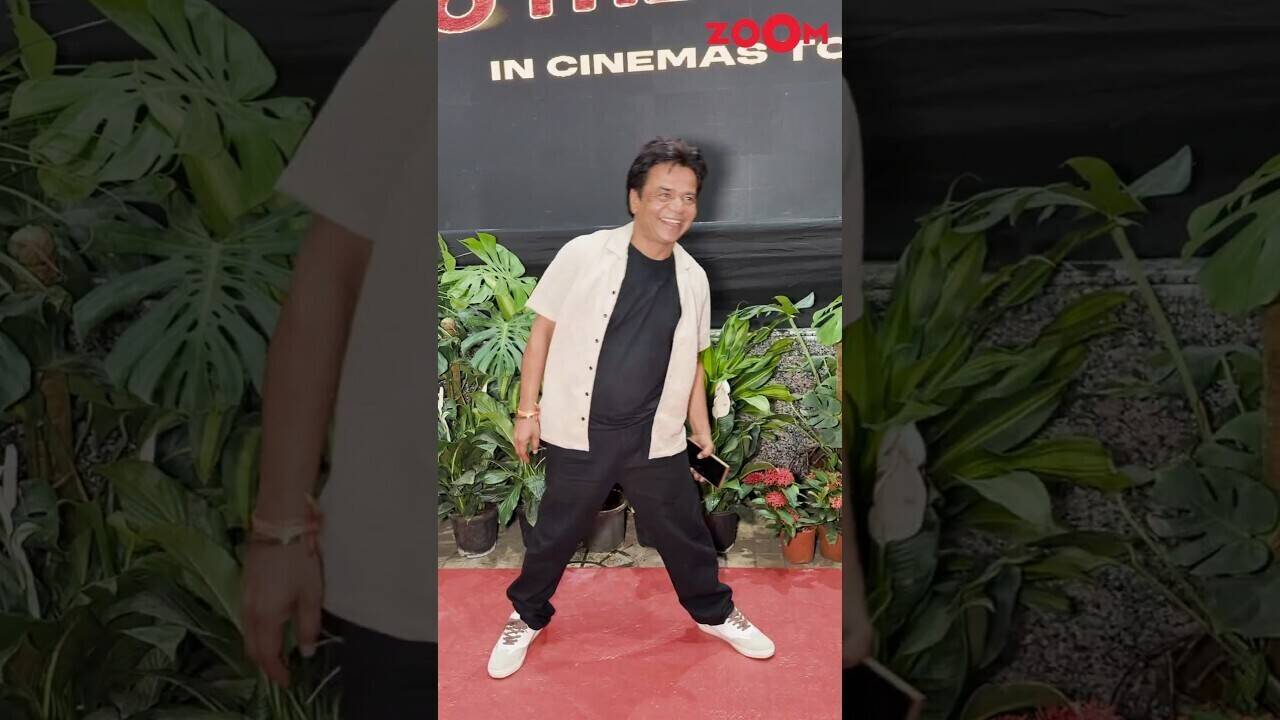 Rajpal Yadav joyfully interacts with photographers at the screening of ...