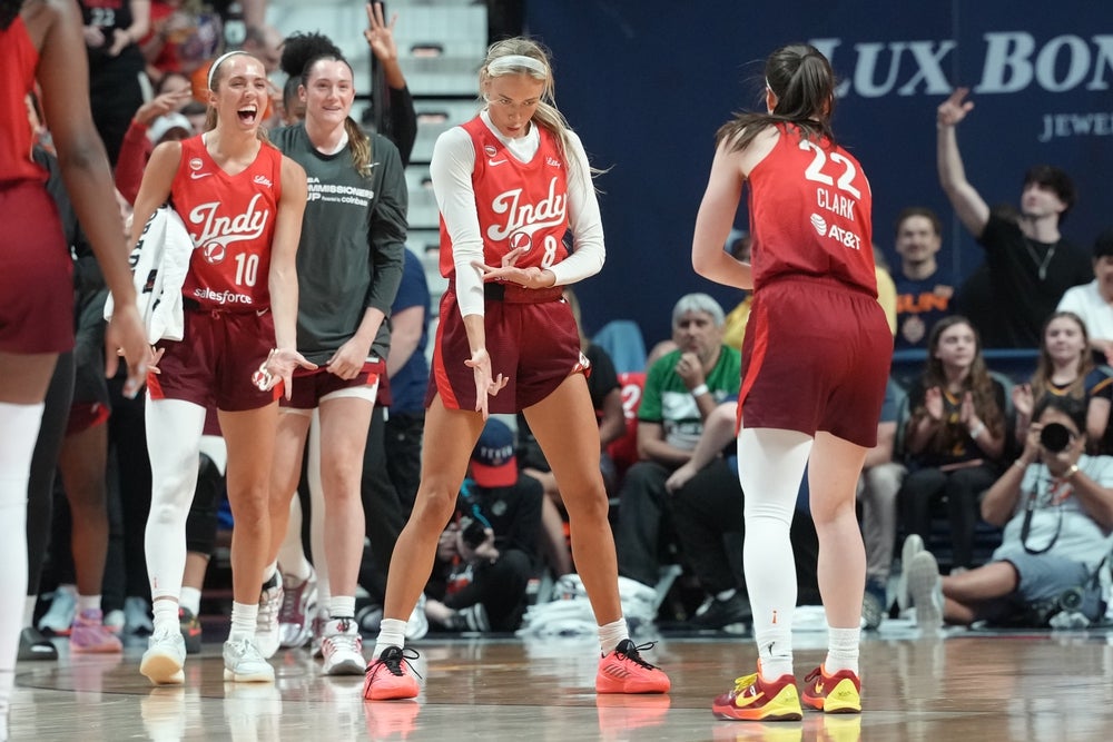 Jun 13, 2026; Uncasville, Connecticut, USA; Indiana Fever guard Sophie Cunningham (8) reacts to making a three-point shot along with her teammates during the second half against the Connecticut Sun at Mohegan Sun Arena. Mandatory Credit: Gregory Fisher-Imagn Images