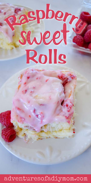 How to make the BEST raspberry sweet rolls! The fluffy roll is perfection filled with juicy raspberries and a cream cheese filling and topped with a yummy raspberry icing.