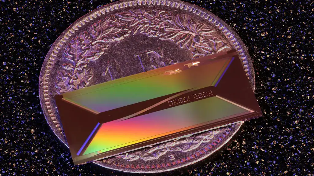 The ultra-fast laser is the size of a penny. Credit: EPFL.