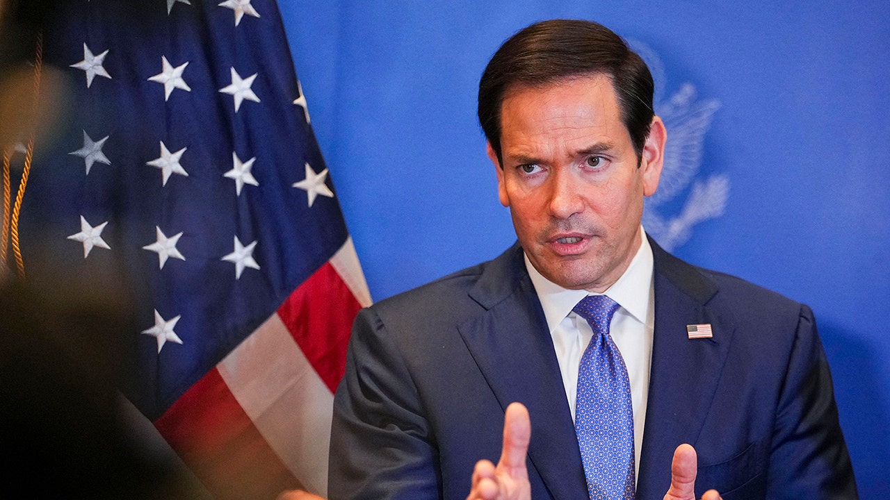 Secretary of State Marco Rubio speaks with members of the media before departing from Bahrain international airport on June 25, 2026.