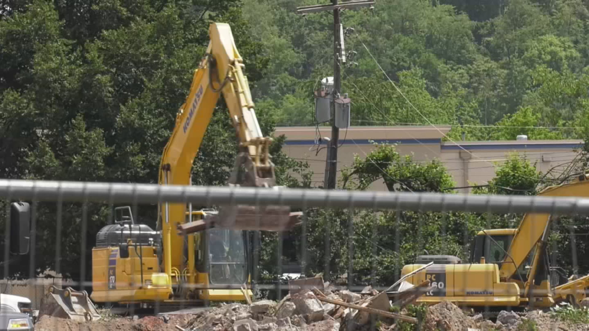 Utility pole breaks during excavation accident, knocking out power for ...