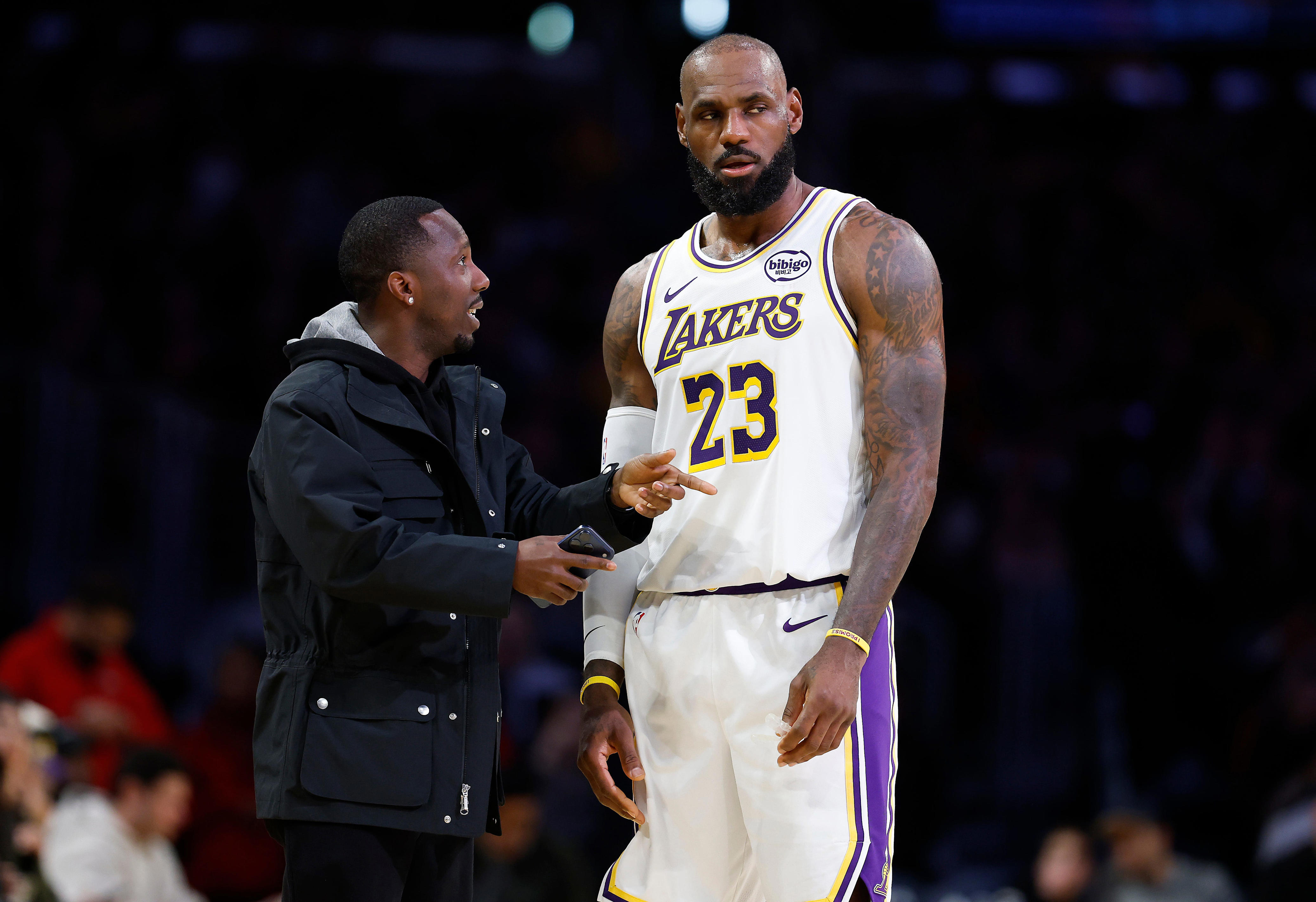 Agent Rich Paul talks with LeBron James during a Jan. 4, 2026 game at Crypto.com Arena in Los Angeles.