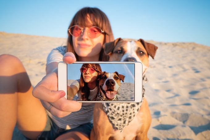Human Taking A Selfie With Dog.