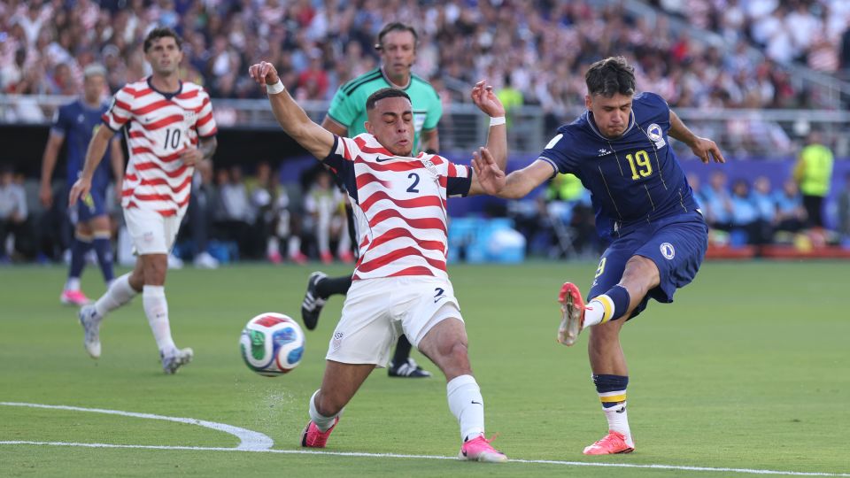 Sergino Dest closes down Kerim Alajbegović during the second half. - Francois Nel/Getty Images