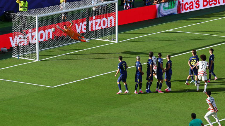 Malik Tillman's free kick curls into the net. - Pedro Nunes/Reuters
