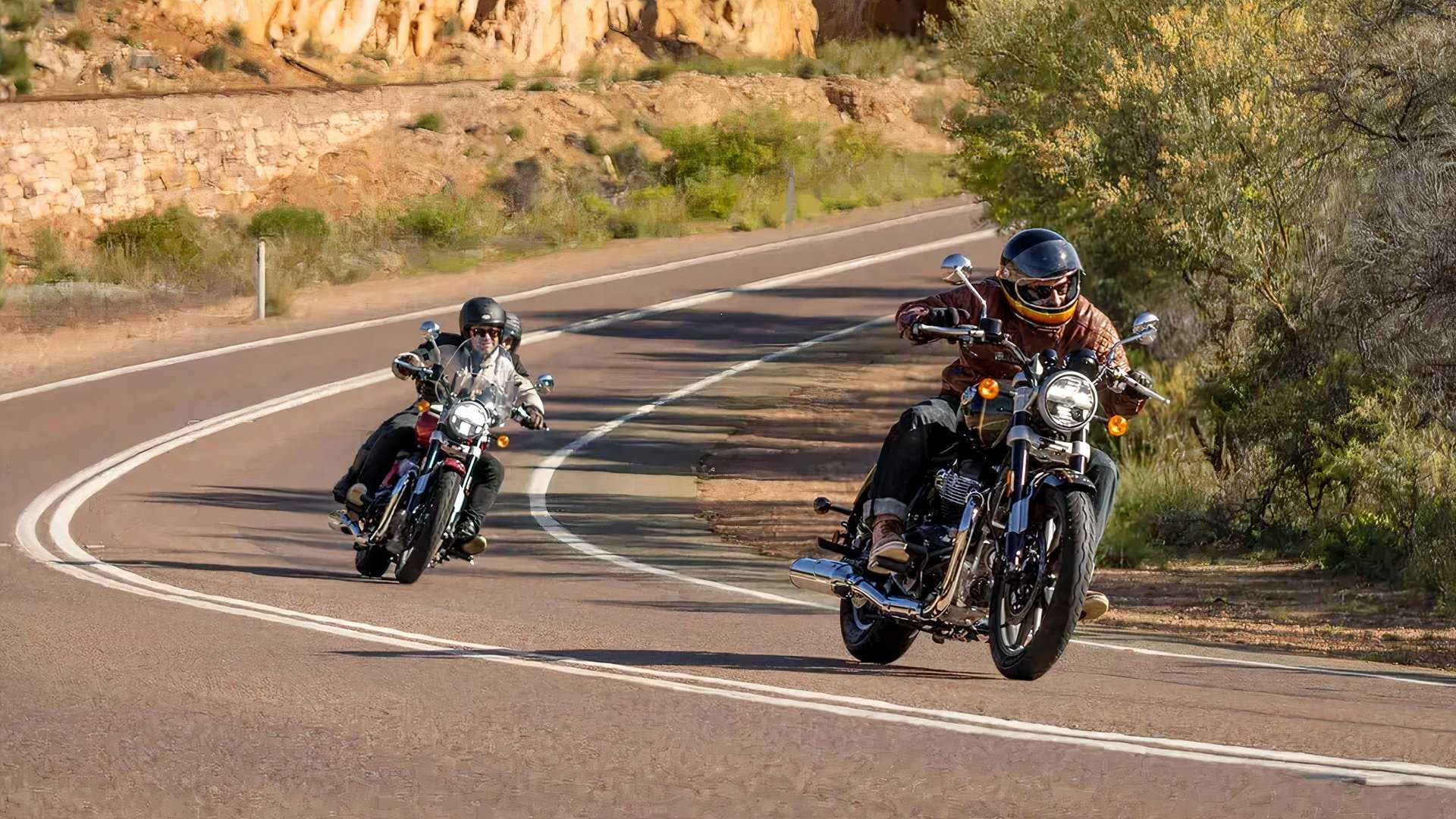 Riders leaning into a corner while cruising aboard the Super Meteor 650