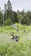 Mountain bike rider fails to pull off backflip and crashes onto ramp