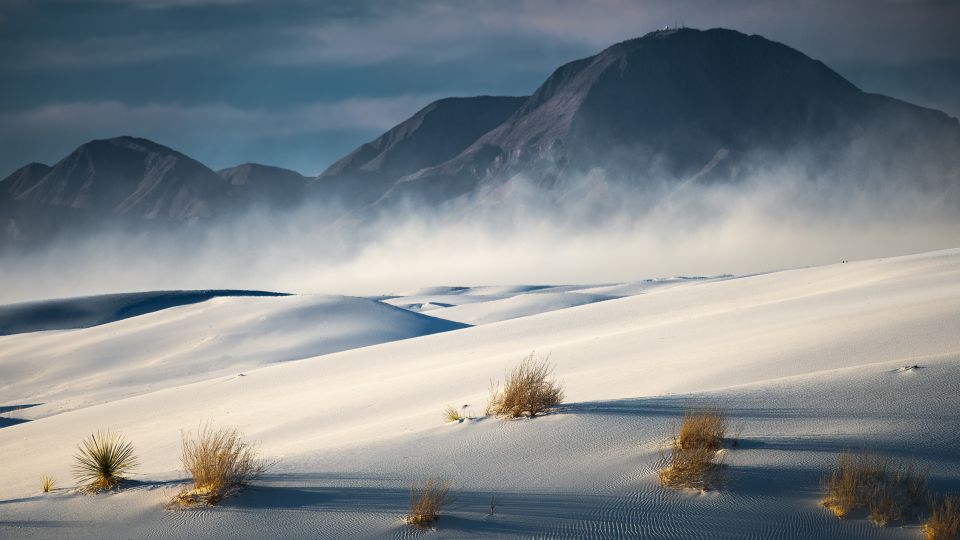 Bring your own saucer or rent one from the visitor center to sled down the snow-like mountains of gypsum at White Sands National Park. - Dean Fikar/Moment RF/Getty Images
