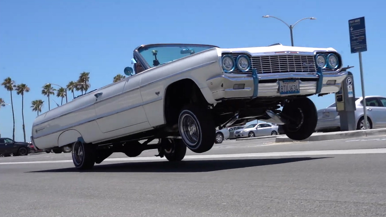 Hydraulic '64 Impala performs incredible two wheel ride