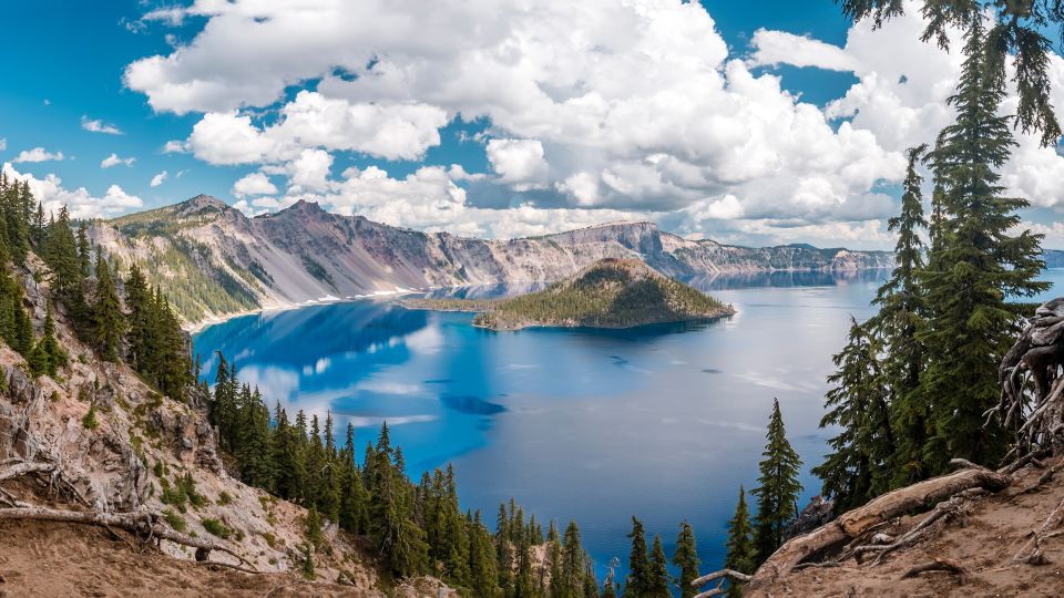 Crater Lake, the deepest lake in the United States, is surrounded by dense conifer forests. - Andrei Bondarenko/iStockphoto/Getty Images