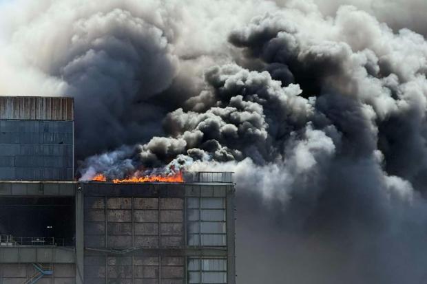 Huge fire breaks out at former power station as residents warned over smoke