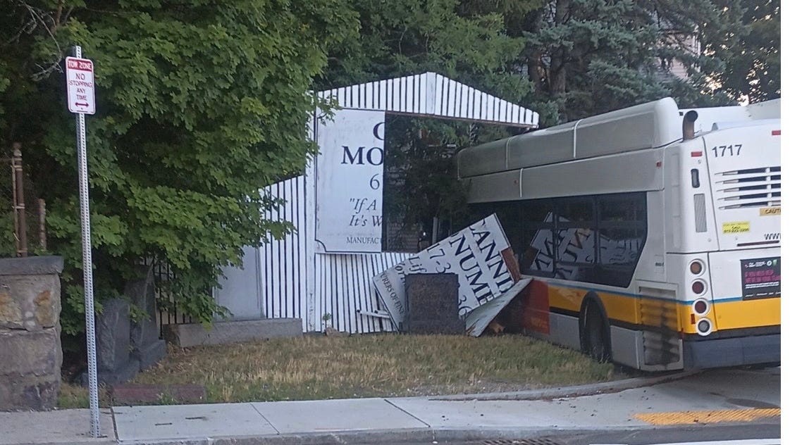 Driver, passenger injured when MBTA bus strikes fence, tree in Mattapan