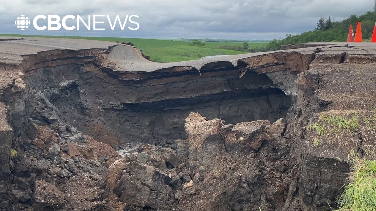 People clean up after heavy rainfall washes out roads, floods towns in ...