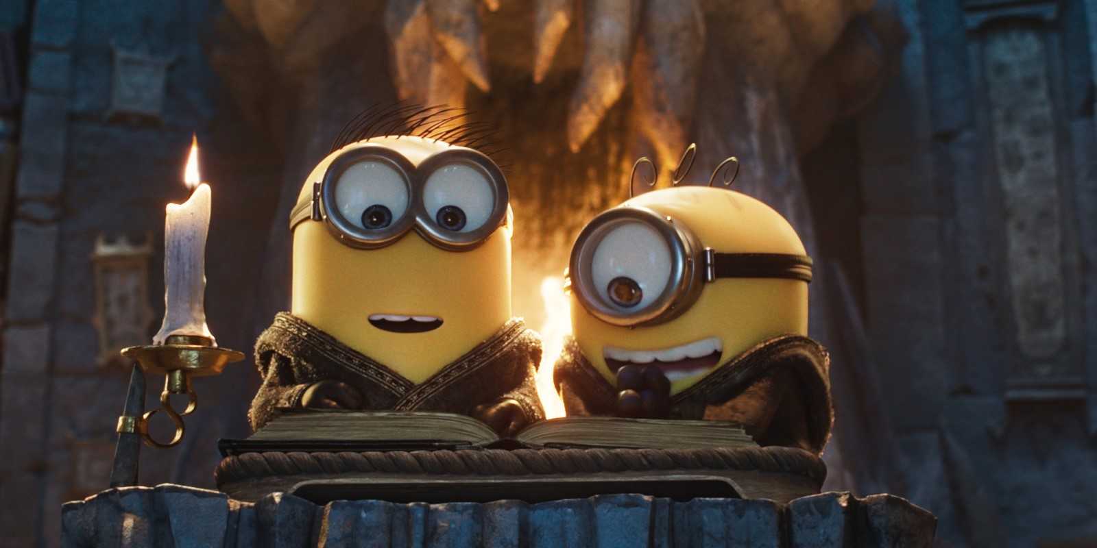 James and Henry reading a book in Minions & Monsters