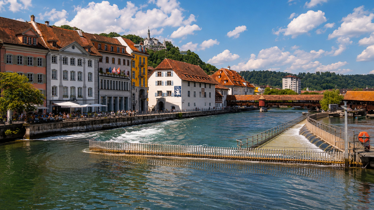 Lucerne river walk past historic bridges and hills