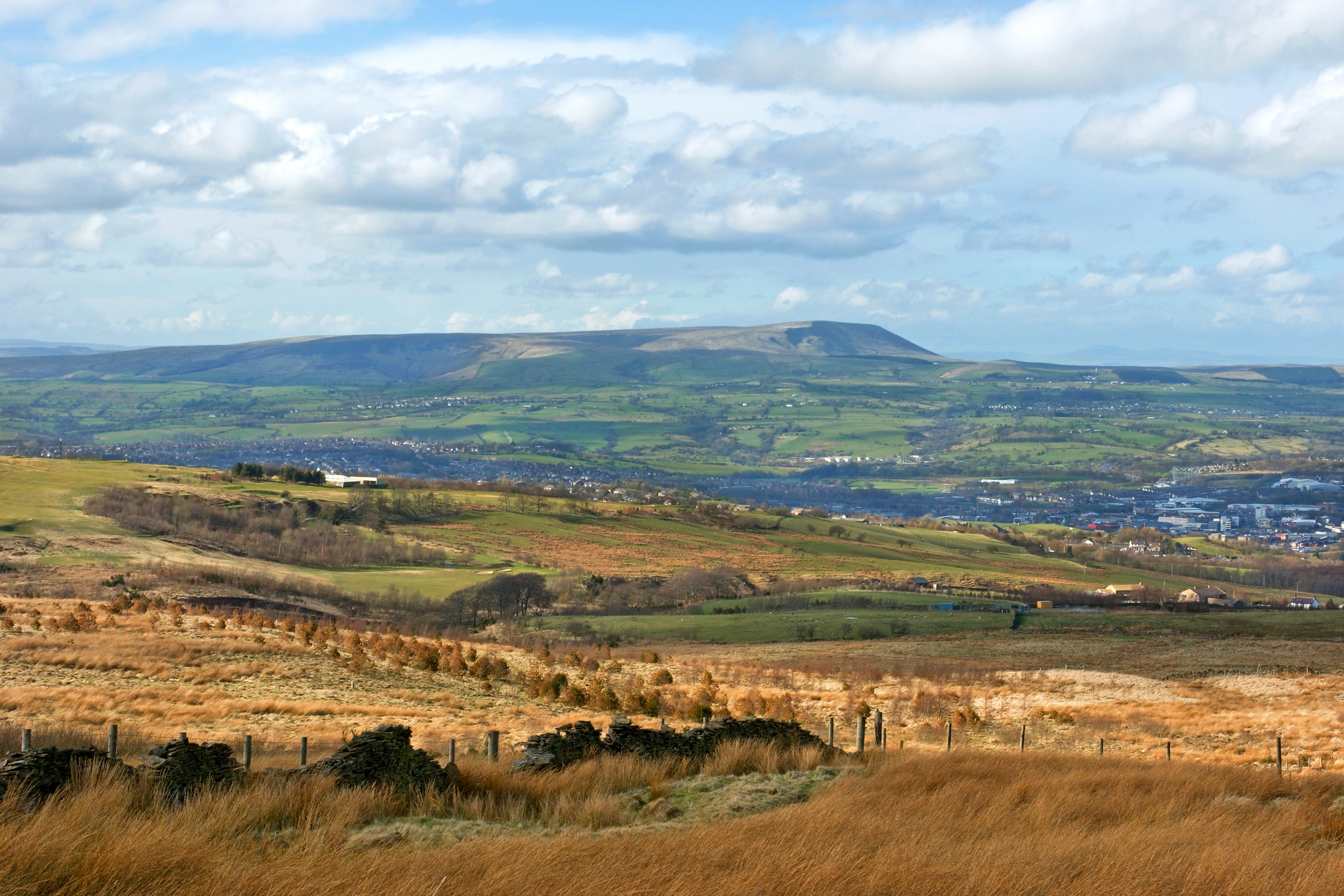 Burnley (pictured here by Pendle hill), Bolton, Oldham and other great Pennine towns also have a considerable cotton history (Getty/iStock)