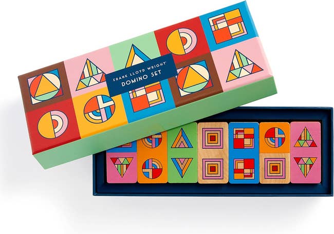 Frank Lloyd Wright-inspired domino set with geometric designs in colorful box, suitable for collectors and design enthusiasts