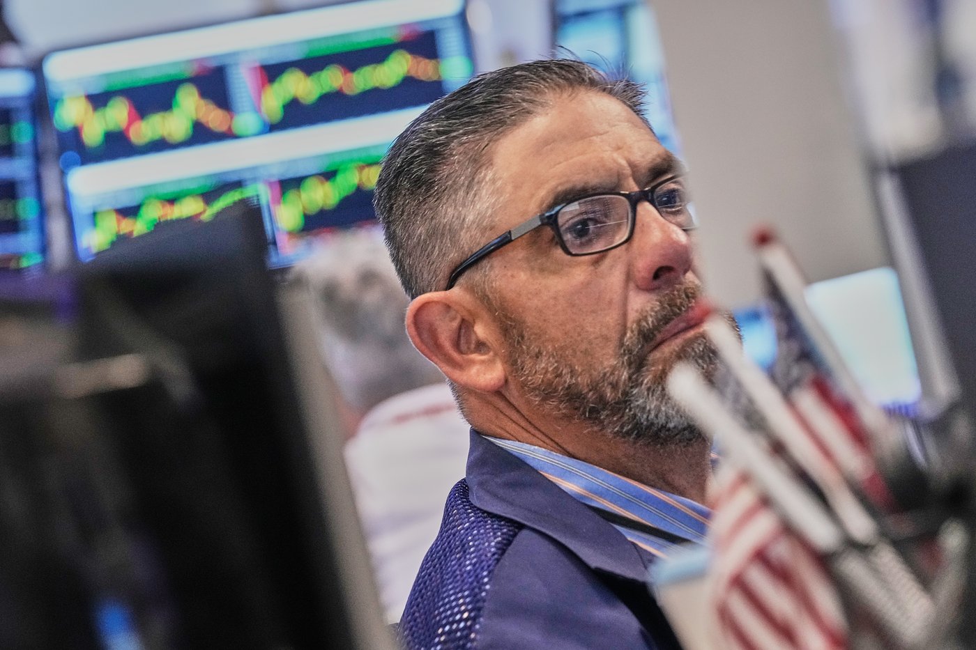 World shares are mixed after Dow hits a new record, as some AI shares ...