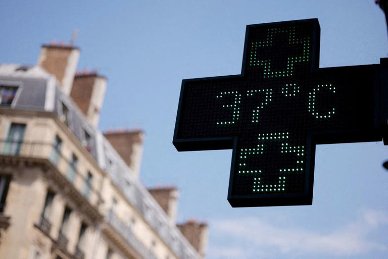 FILE PHOTO: A pharmacy sign displays a temperature of 37 degrees Celsius as temperatures rise in Paris during a second heatwave affecting a large part of France, June 19, 2026. REUTERS/Alice Sacco/File Photo