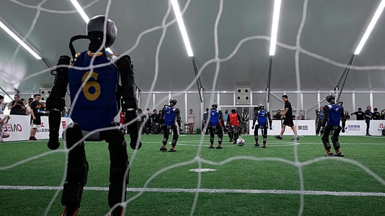 Humanoid robots showcase football skills