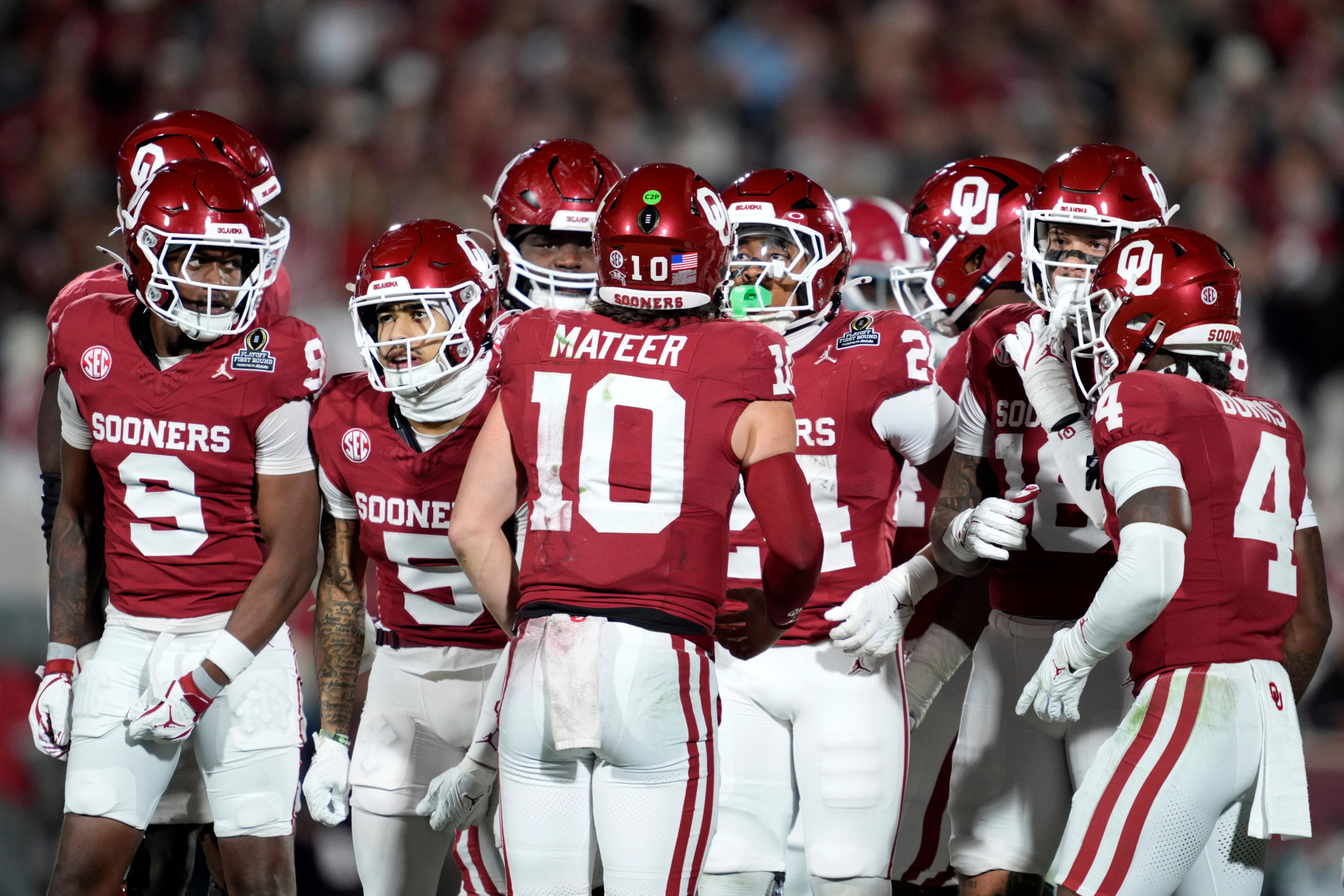 Oklahoma Sooners quarterback John Mateer (10) huddles with players before a play during a first-round College Football Playoff game between the University of Oklahoma Sooners (OU) and the Alabama Crimson Tide at Gaylord Family - Oklahoma Memorial Stadium in Norman, Okla., Friday, Dec. 19, 2025. Alabama won 34-24.