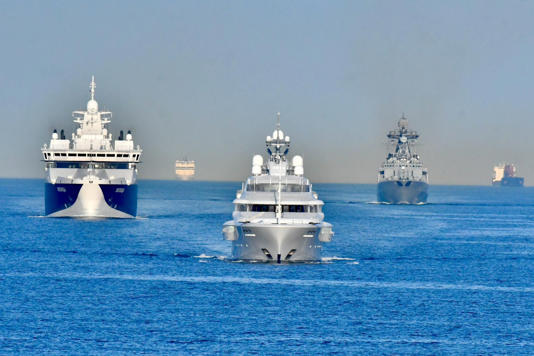 The Graceful superyacht being shadowed by a Russian destroyer (right) and a salvage and patrol ship - Frank Behling