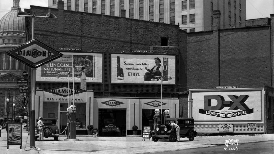 A billboard shows an advertisement for Ethyl gasoline at a Diamond D-X Service Station in Madison, Wisconsin, in May 1935. - Angus B. McVicar/Wisconsin Historical Society/Getty Images