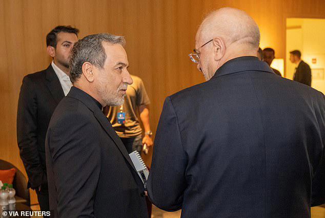 Minister of Foreign Affairs of Iran, Seyyed Abbas Araghchi, left, and Speaker of the Islamic Parliament of Iran, Mohammad Bagher Ghalibaf, right, at the Buergenstock resort in Obbuergen, near Lucerne, Switzerland