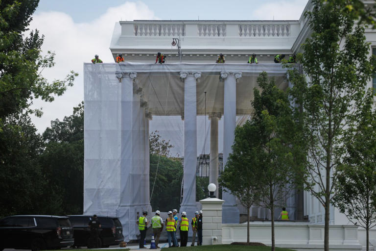 Trump posts photo of ornate columns as tarps cover White House portico